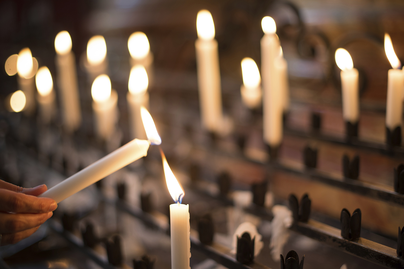 Woman Lighting Prayer Candle Catholic Recruiter